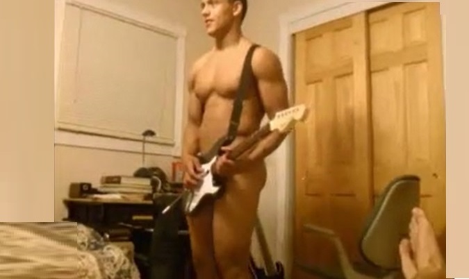 Straight boy playing guitar naked in front of friend