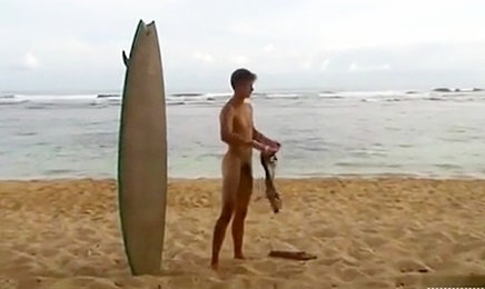 Surfer boy naked and jerking off on the beach