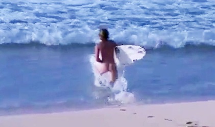 Twink surfer surfs naked on the beach