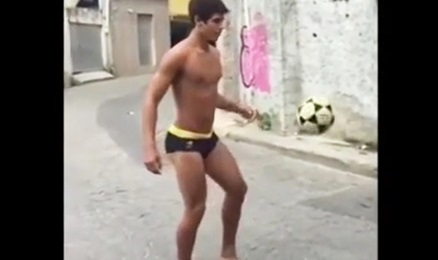 Hot straight boy playing soccer in his underwear in the middle of the street